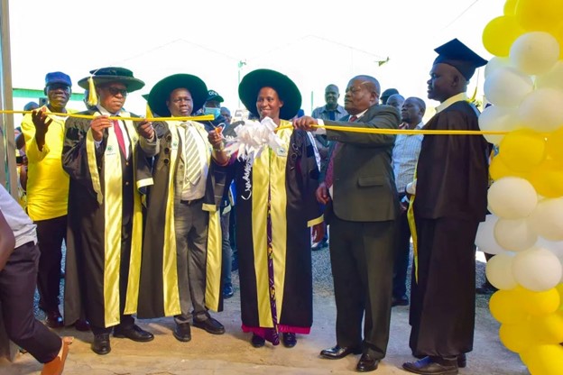 The State House Comptroller Jane Barekye (in the centre) cutting the tape as a symbol to signify that the hub  launched during the 1st graduation of the Presidential Initiative for Zonal Industrial Parks for Skills Development, Value Addition and Wealth creation at the Acholi Zonal Industrial Hub in Gulu district, Aswa County, Unyama Sub-county, Oding Village on 3rd January 2023    