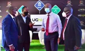  Collin Mugasha; Director E-Government Services at NITA Uganda, Hon. James Kyewalabye Kabajo; Ag. Board Chairman NITA Uganda, Dr. Hatwib Mugasa; Executive Director at NITA Uganda, and Julius Torach; Commissioner IT, Ministry of ICT & NG taking a lite moment at the launch of the UGHub