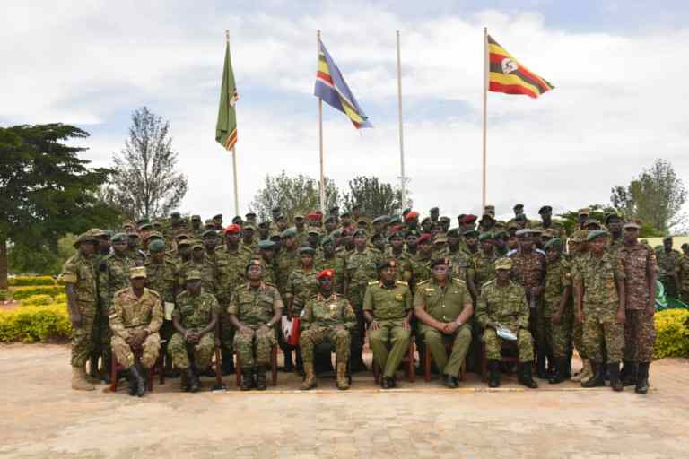 A photo of young UPDF officers with a commandant of military police Maj Gen Don Nabaasa after the pass out ceremony at the Oliver Reginald Tambo School of Leadership, Kaweweta in Nakaseke District on Friday 21st April 2023