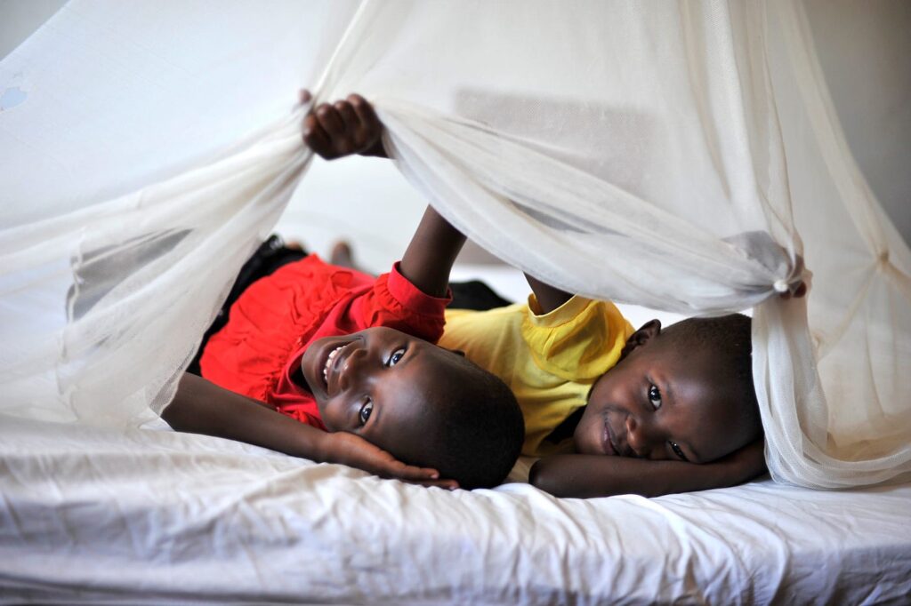 Children sleeping under an insecticide-treated bed net