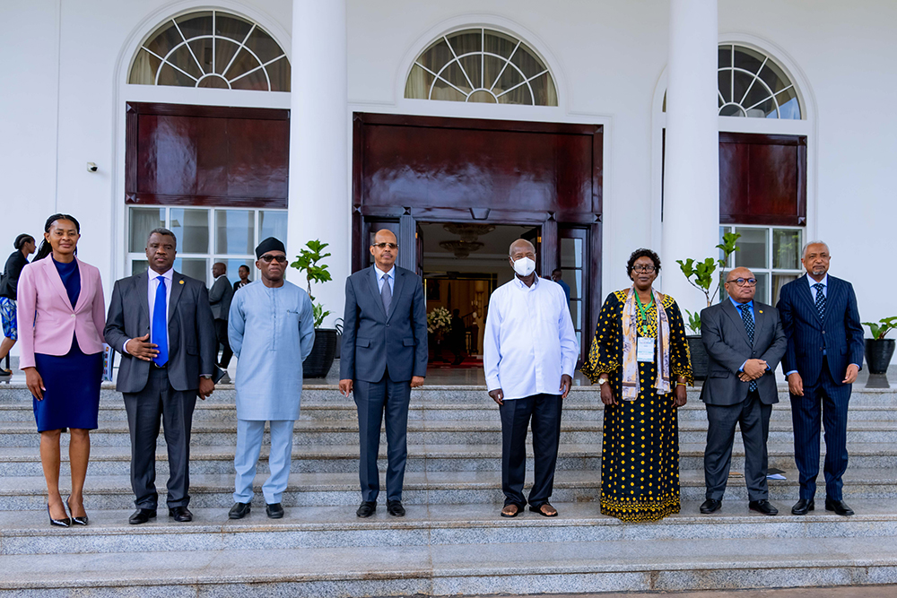 President Museveni (centre) posing for a group photo with Mahmoud Ali Youssouf (4th left), the newly elected Chairperson of the African Union (AU) Commission and other officials after the meeting at State House Entebbe.